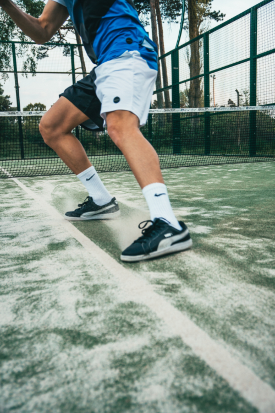 Tennis player moving across the court